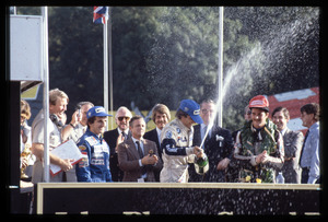 Il podio della gara: al centro, il vincitore Nelson Piquet della Brabham, a destra Alain Prost della Renault e a sinistra Nigel Mansell della Lotus, terzo classificato